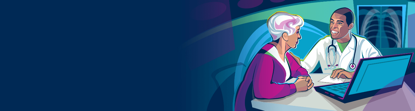 A doctor speaking with a patient at his desk. 