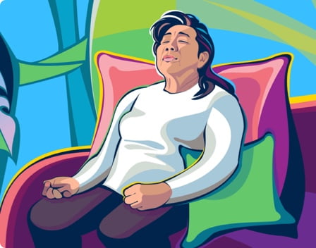 A woman resting on a couch.