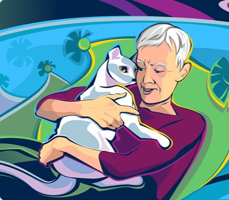 An older woman hugging her cat.