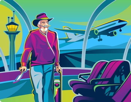 An  older man receiving oxygen supplementation from an oxygen concentrator while walking through an airport.