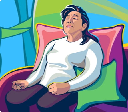 A woman resting on a couch.