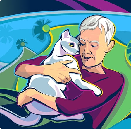 An  older woman hugging her cat.